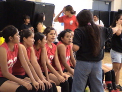 Coach Darlene Bedoni of Team AZ regrouping her girls and assuring all teammates have  equal playing time